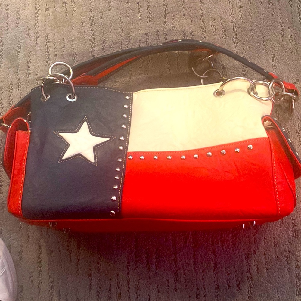 Montana West Texas Flag purse. Never been used. Perfect for the TX rodeo lover.